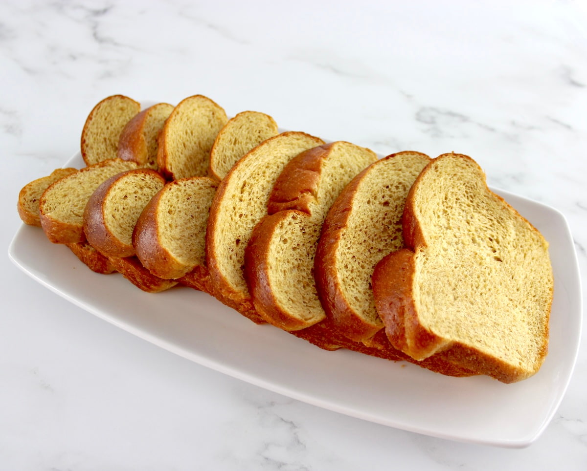 8 thick slices Keto brioche bread on white plate