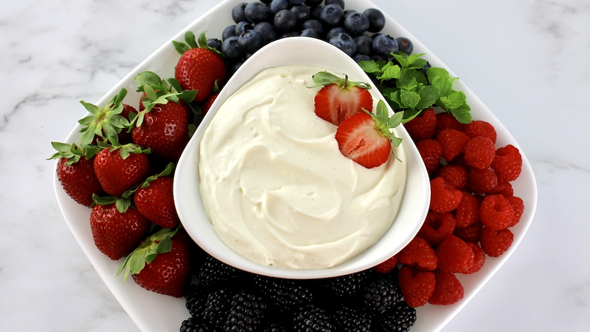 Keto Fruit Dip with fresh berries on side of white platter