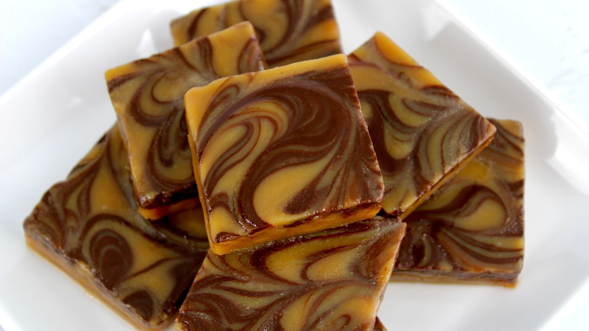 Keto Peanut Butter Chocolate Fudge squares stacked up