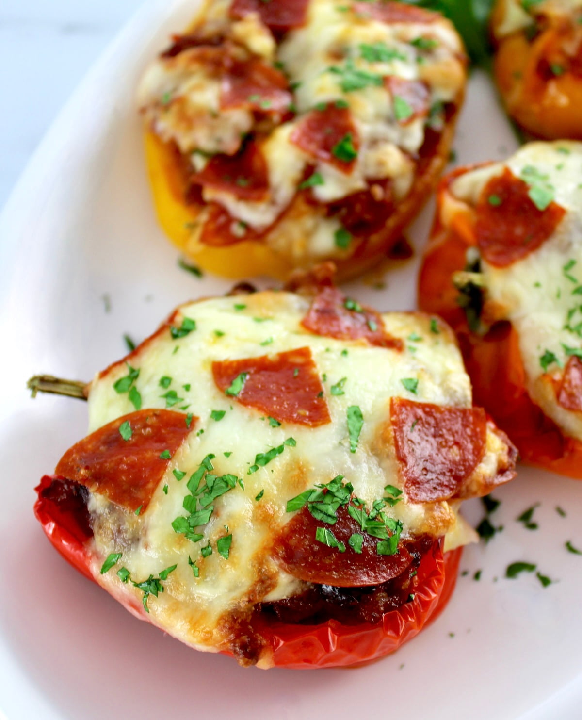 closeup of Pizza Stuffed Peppers on white dish