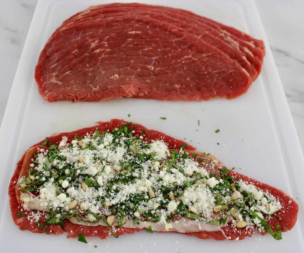 Italian Beef Braciole uncooked on white cutting board