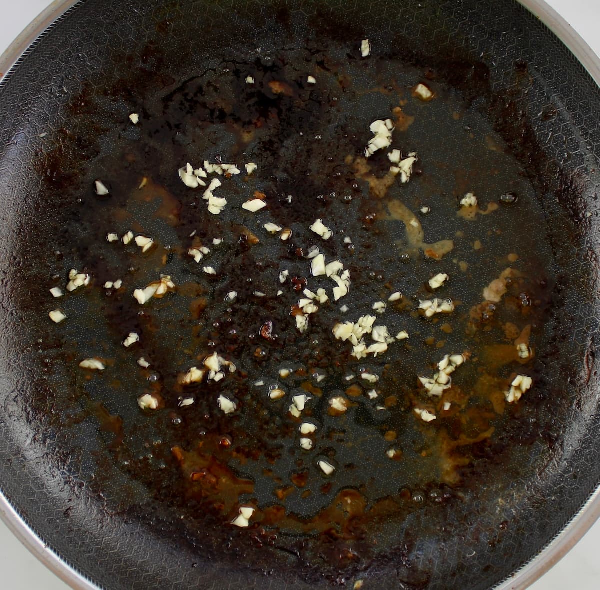 minced garlic in skillet