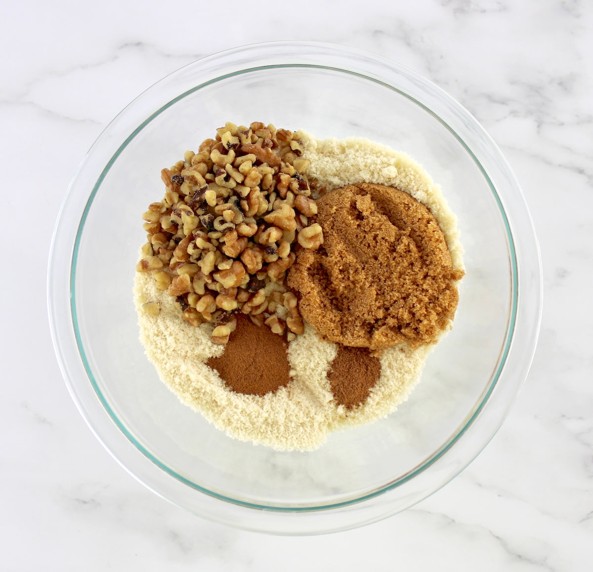 Keto Coffee Cake crumble ingredients in glass bowl unmixed