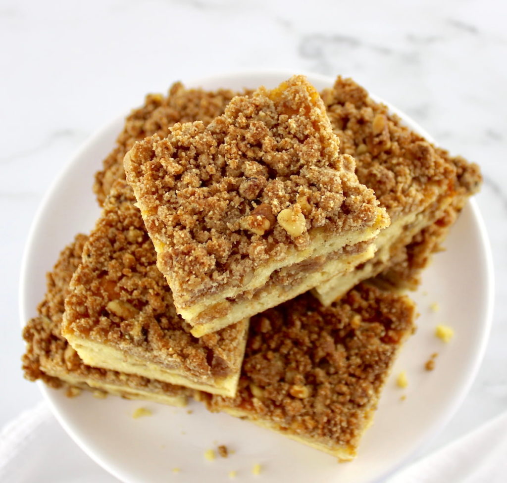 overhead view of Keto Coffee Cake stacked up on white plate