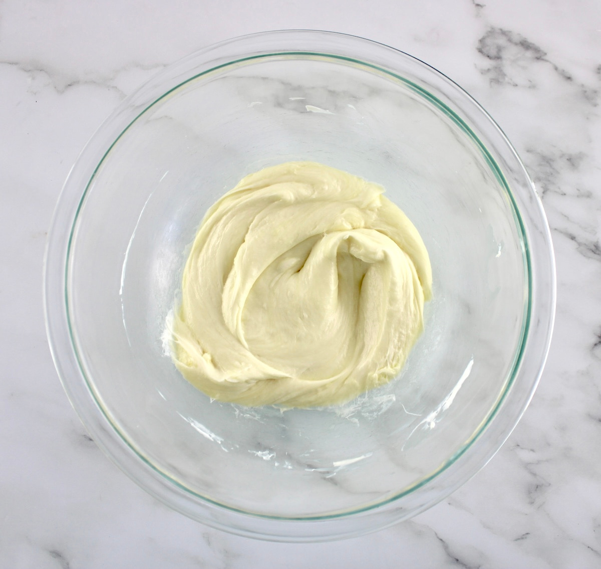 melted mozzarella and cream cheese in glass bowl