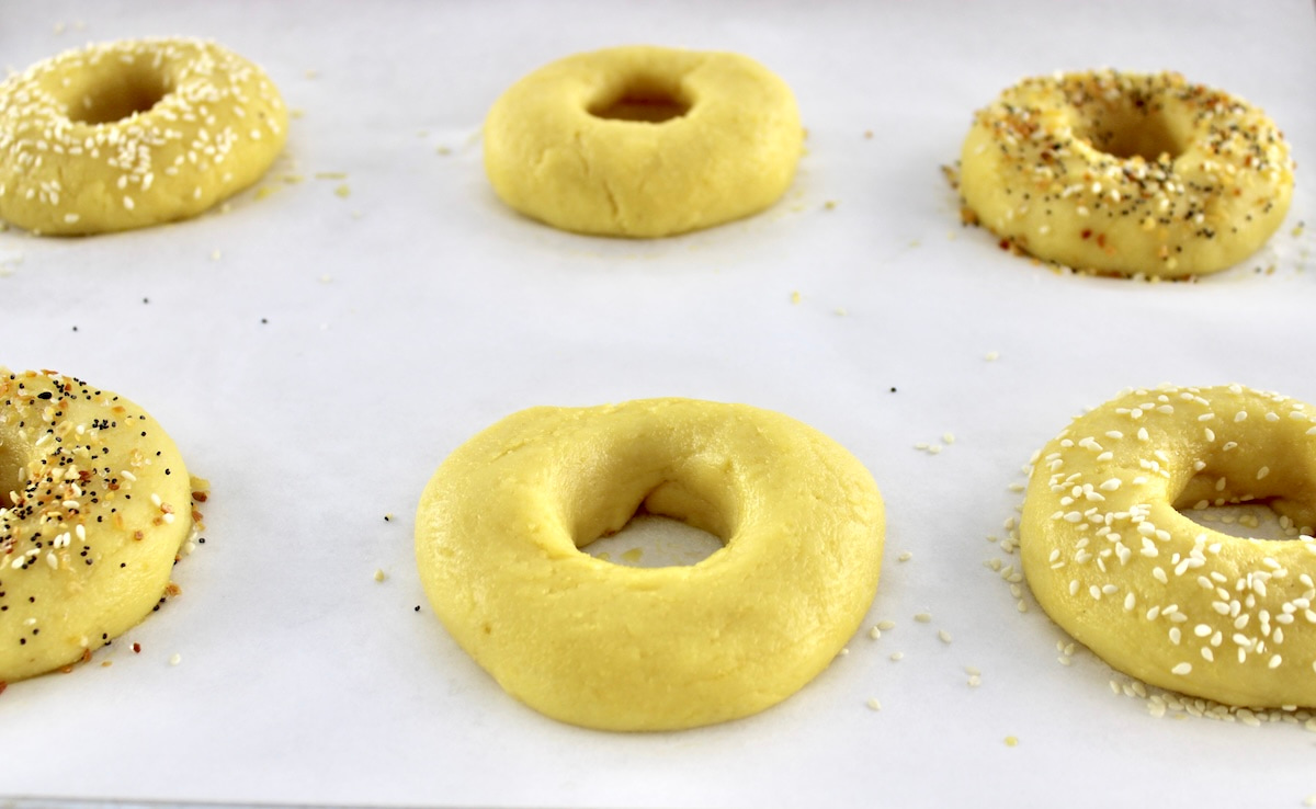 uncooked Keto Fathead Bagels on parchment paper