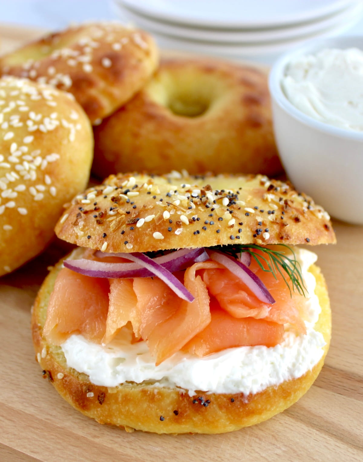 Keto Fathead Bagel with cream cheese and smoked salmon on white plate