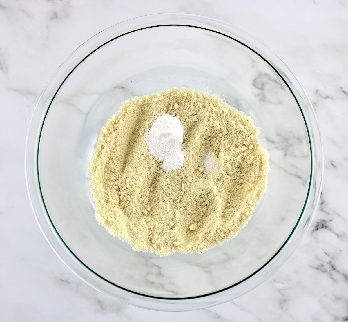 almond flour, baking powder and salt in glass bowl unmixed