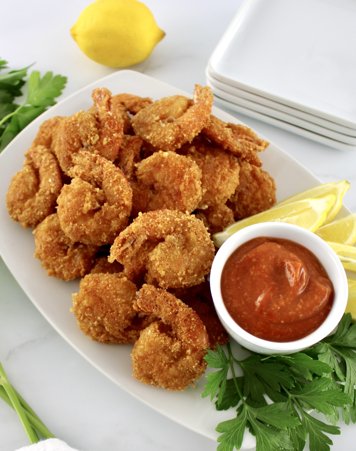 overhead view of Keto Fried Shrimp with Cocktail Sauce in white bowl