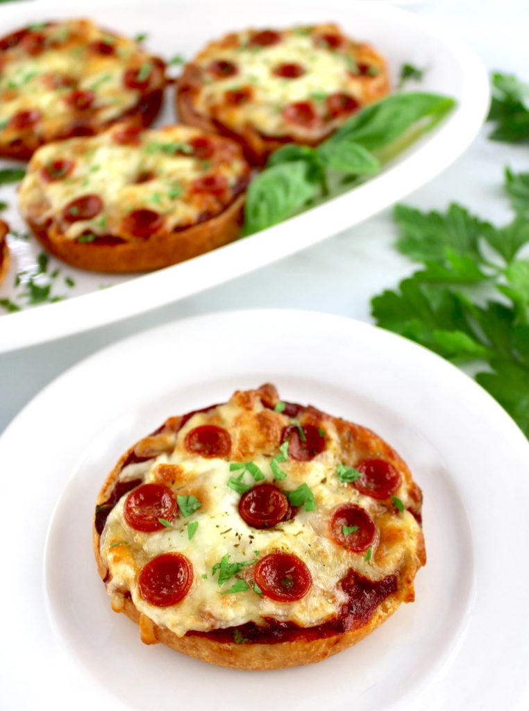 Pepperoni Pizza Bagels on white plate