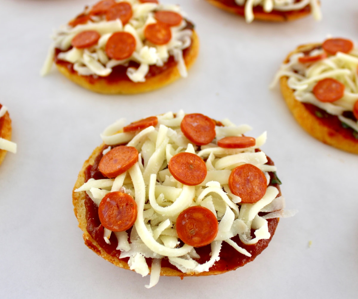 Pepperoni Pizza Bagels on parchment paper unbaked