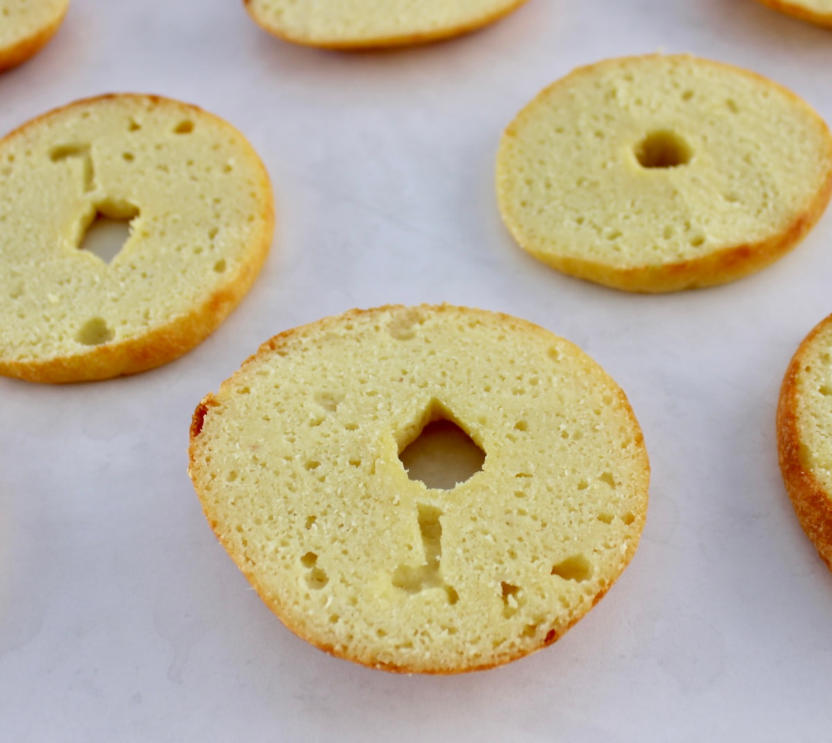 bagels halves on parchment paper