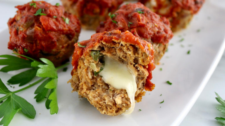 Stuffed Italian Mini Meatloaves with mozzarella cheese oozing out