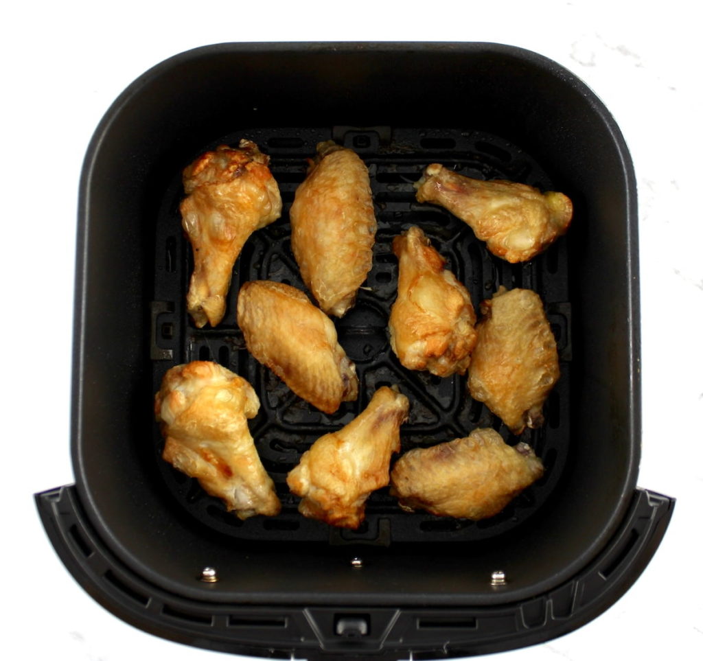 9 crispy chicken wings in air fryer basket