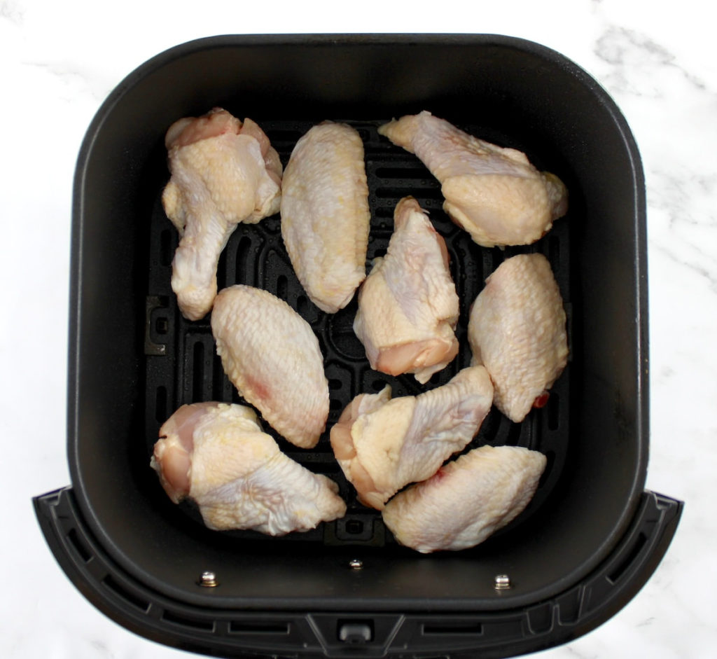 9 raw chicken wings in air fryer basket