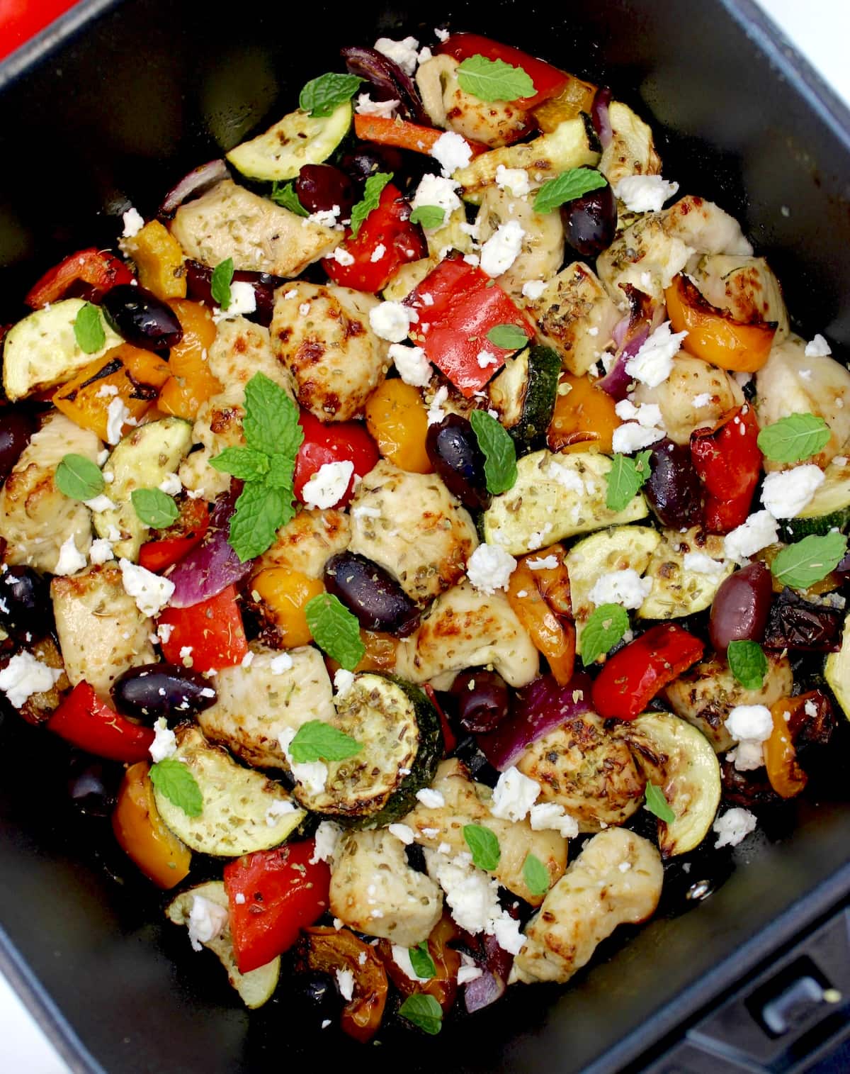 closeup of Air Fryer Greek Chicken Bites in air fryer basket