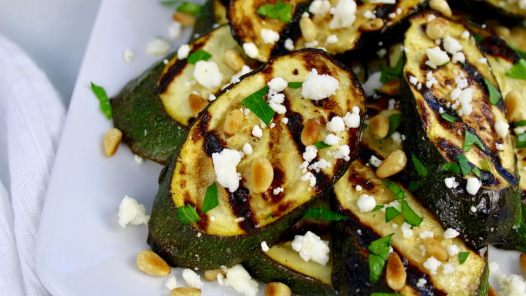 grilled zucchini slices with lemon slices feta and pine nuts