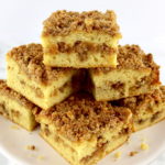 slices of Keto Coffee Cake stacked up on cake plate