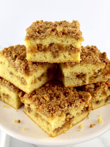 slices of Keto Coffee Cake stacked up on cake plate
