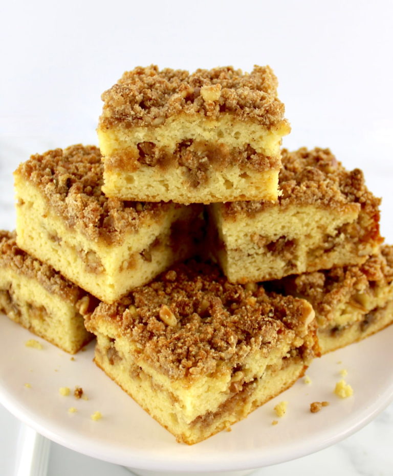 slices of Keto Coffee Cake stacked up on cake plate