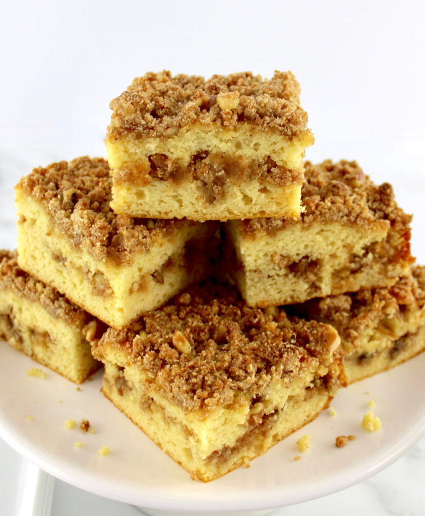 slices of Keto Coffee Cake stacked up on cake plate