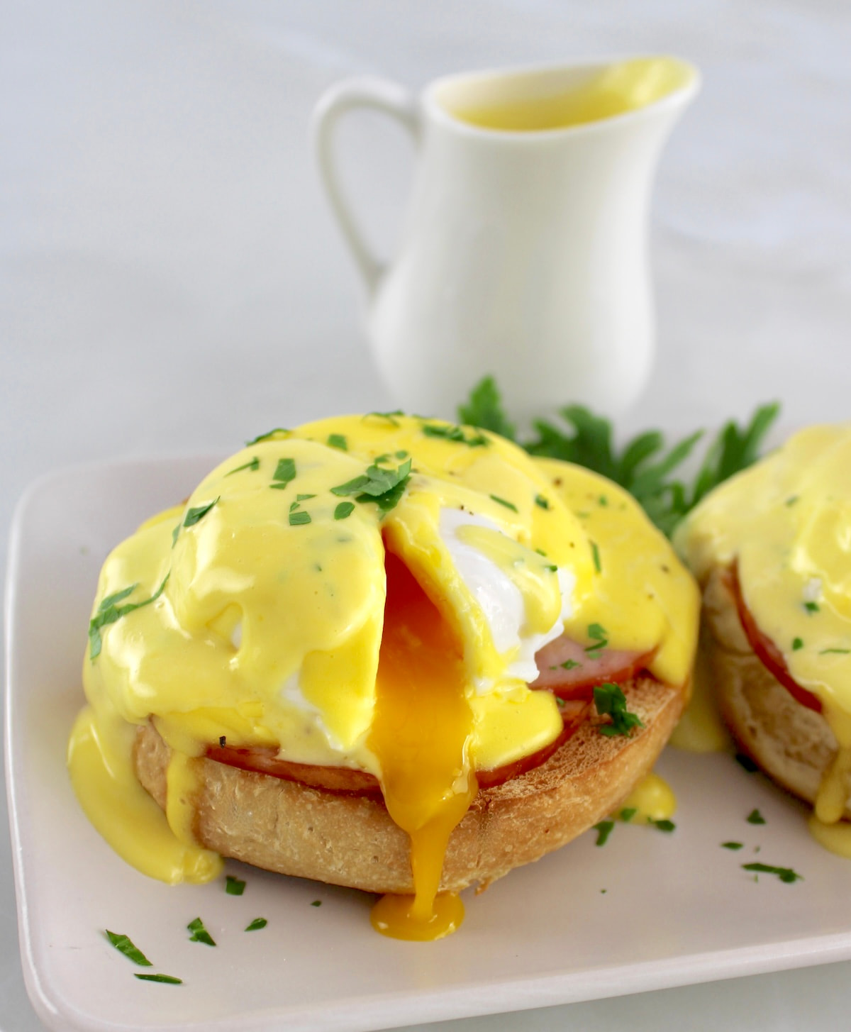 closeup of Keto Eggs Benedict with yolk dripping down the side