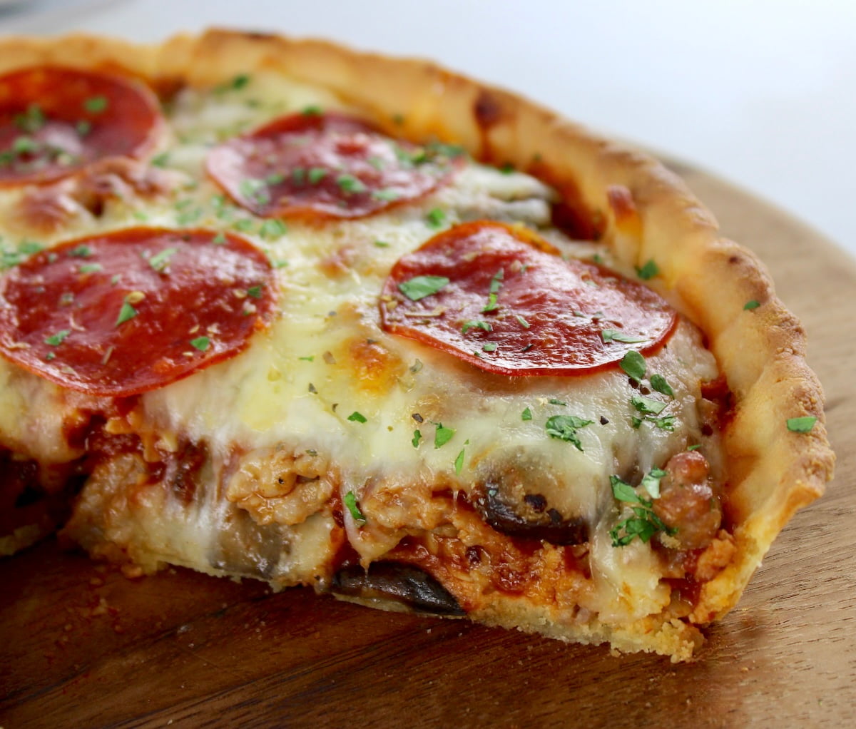 closeup of cut side of Keto Sausage and Pepperoni Pizza Pie