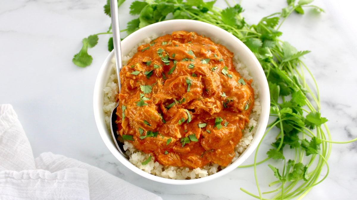 overhead view of a white bowl with butter chicken