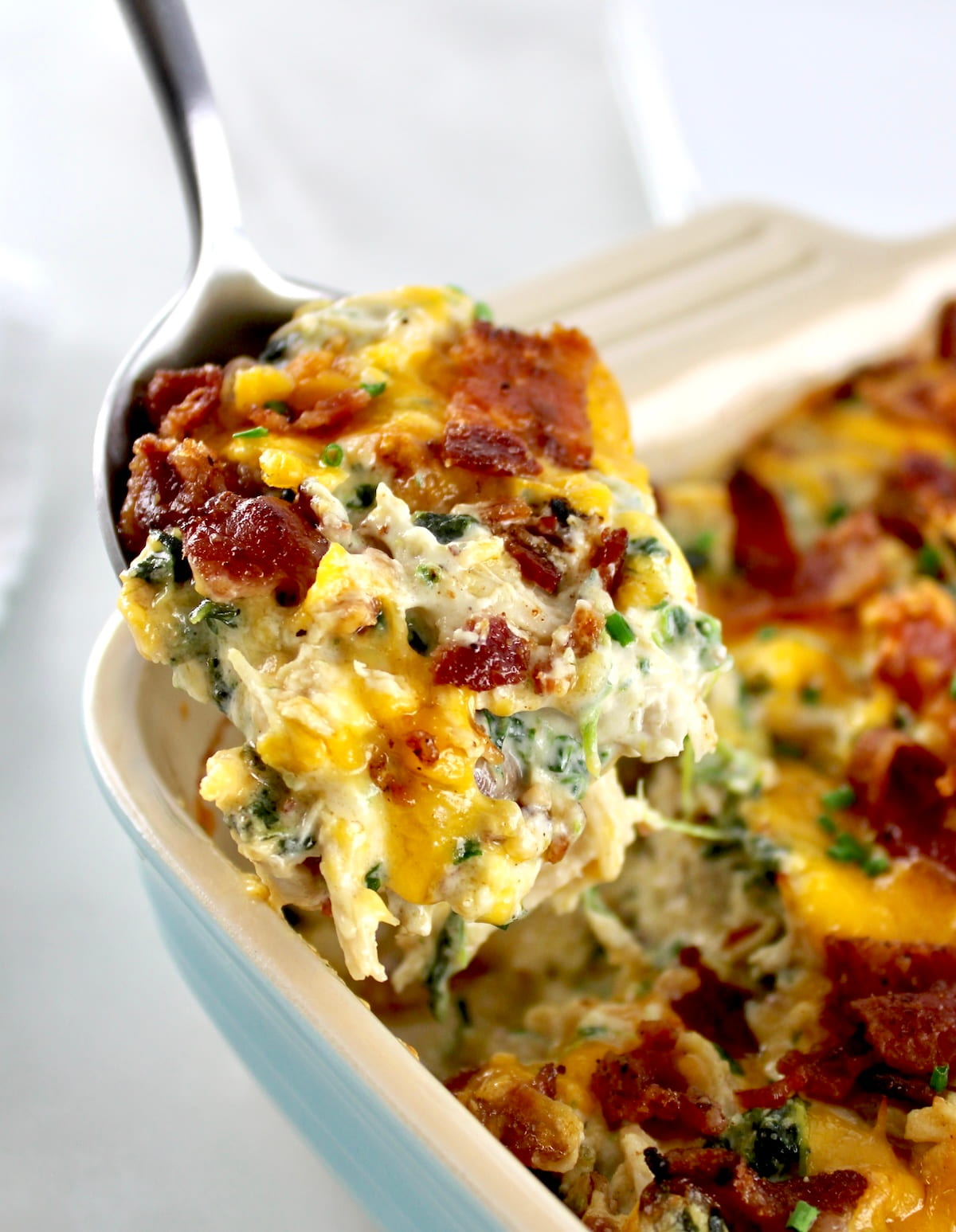 scooping out piece of Bacon Ranch Chicken Casserole