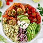 Chimichurri Shrimp Avocado Bowl with sour cream and chopped cilantro on top