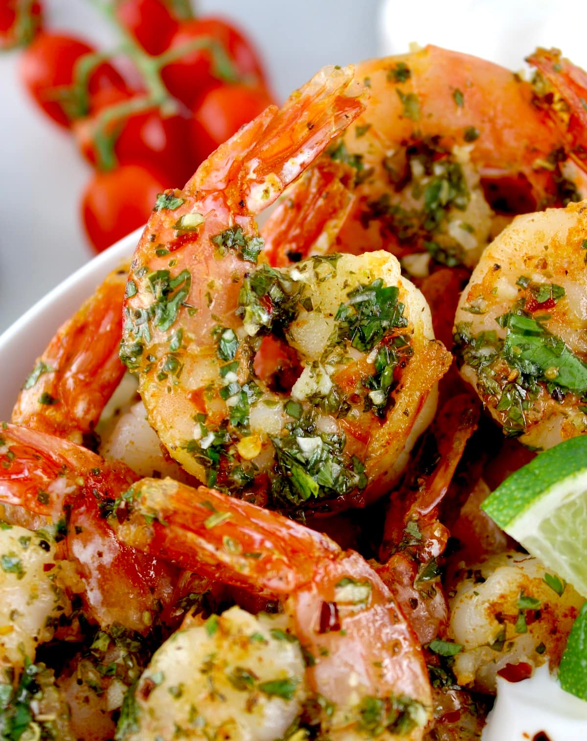 closeup of chimichurri shrimp in white bowl