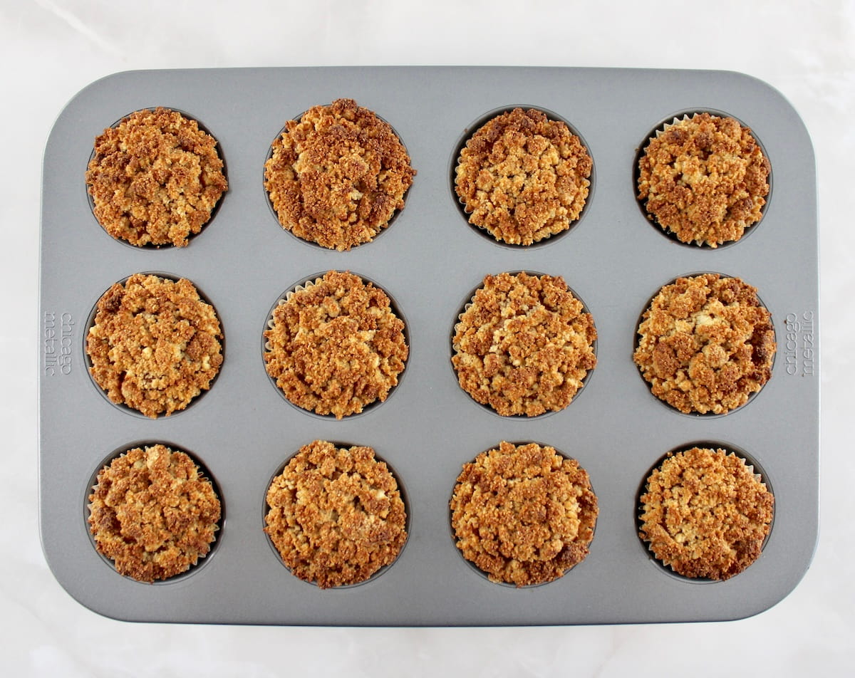 baked Keto Pumpkin Coffee Cake Muffins in muffin pan