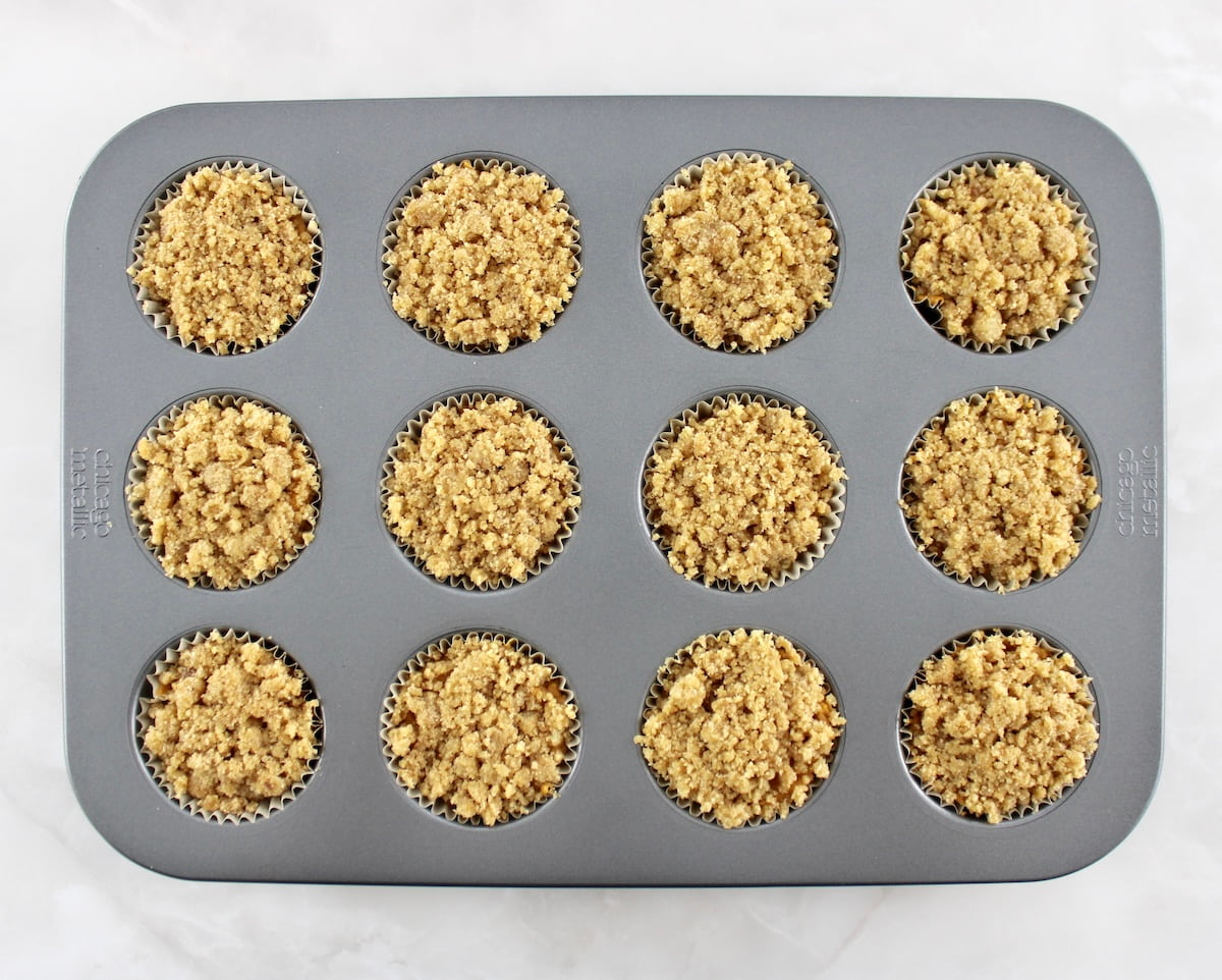 Keto Pumpkin Coffee Cake Muffins unbaked in muffin pan