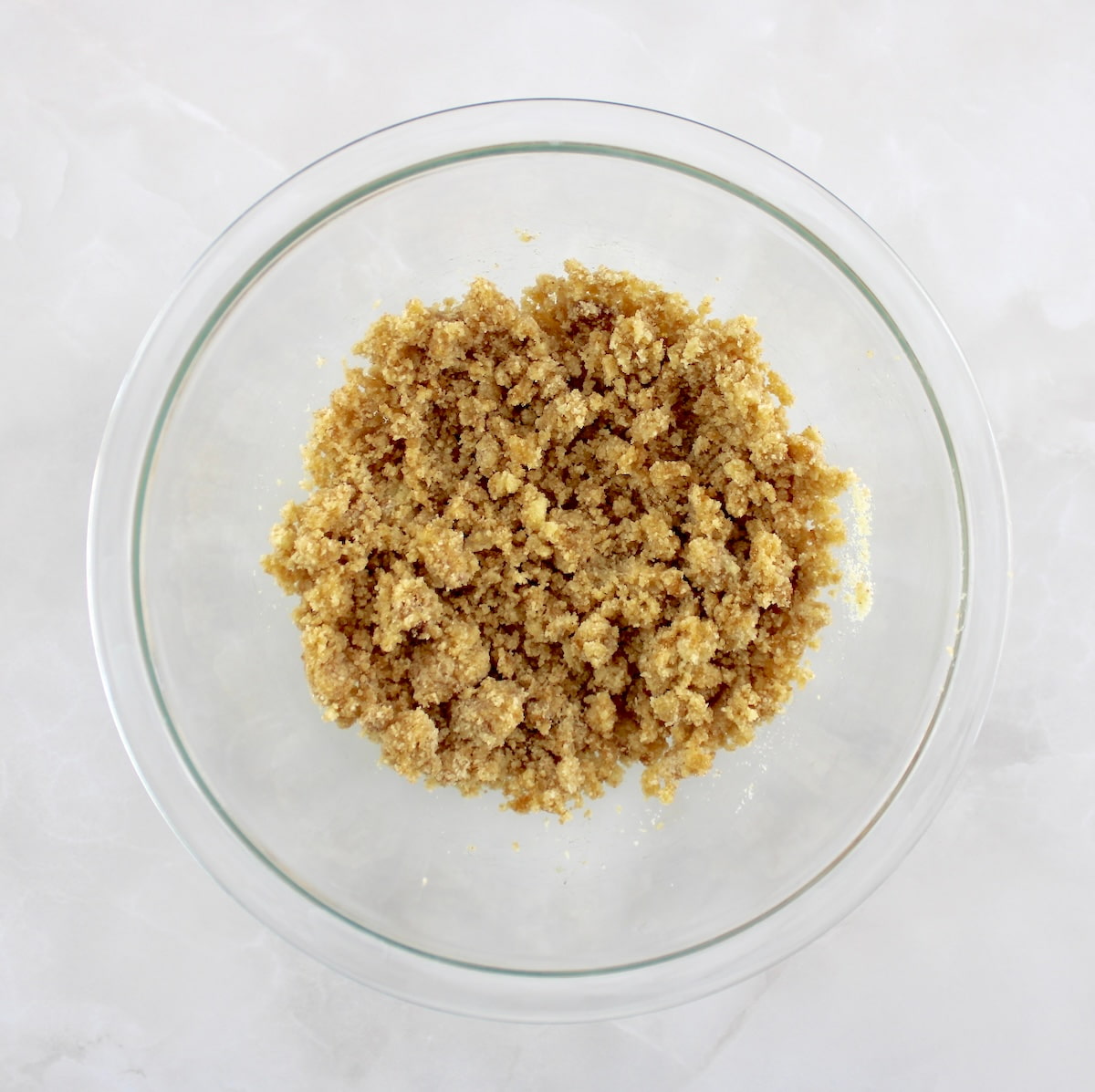 Keto Pumpkin Coffee Cake Muffins streusel topping in glass bowl