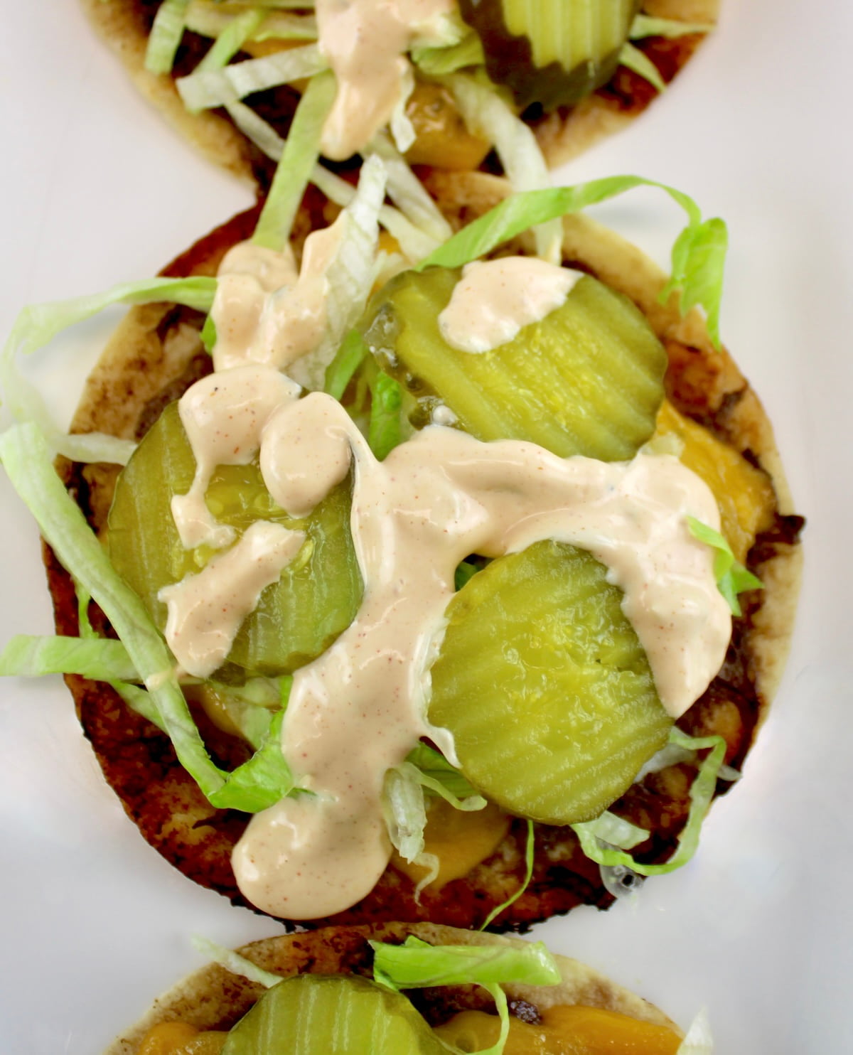 overhead view of Keto Smash Burger Tacos on white plate