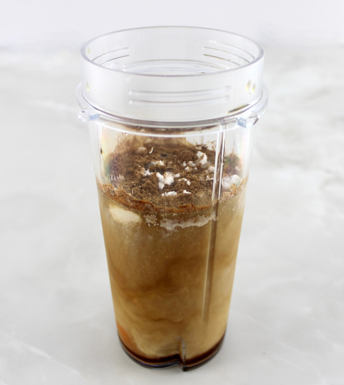 Pumpkin Spiced Bulletproof Coffee ingredients in bullet blender cup unmixed