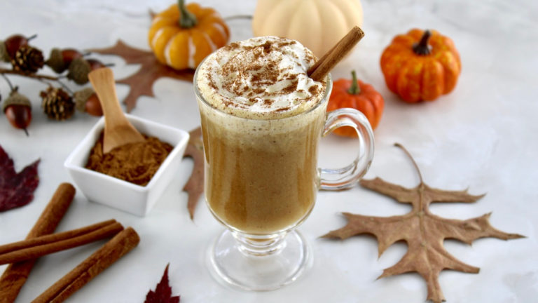Pumpkin Spiced Bulletproof Coffee in glass mug with whip cream on top