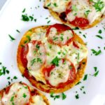 overhead view of Smash Burger Pizza Tacos on white plate with fresh parsley