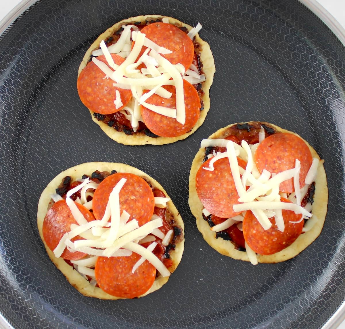 Smash Burger Pizza Tacos cooking in skillet