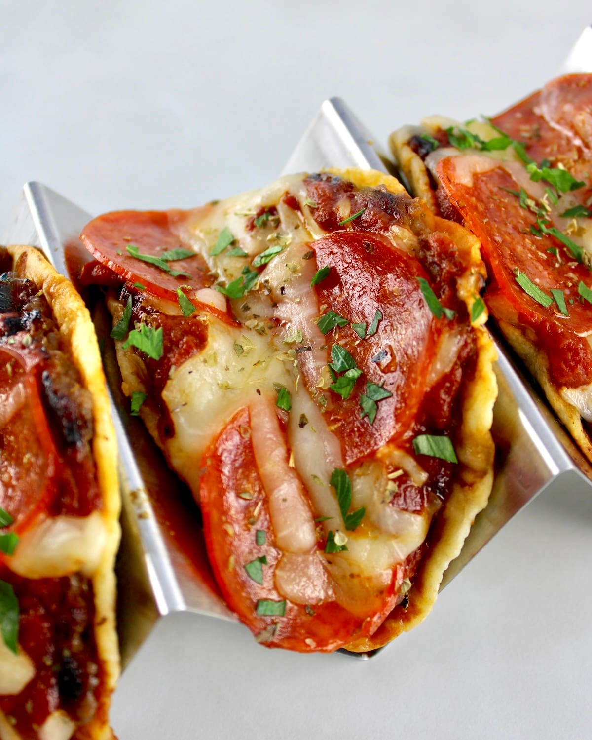3 Smash Burger Pizza Tacos in silver taco rack