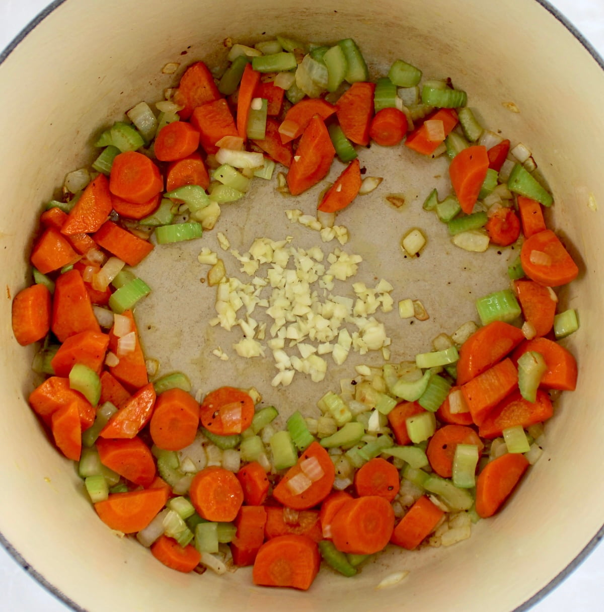 chopped carrots, onions and celery in pot