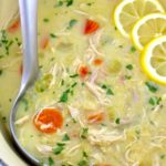 closeup of Avgolemono Soup in pot with ladle on side