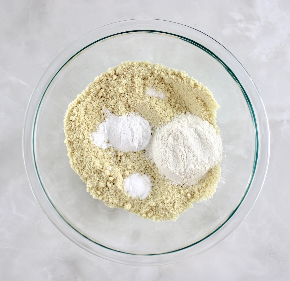 Keto Cheddar Jalapeño Cornbread dry ingredients in glass bowl unmixed