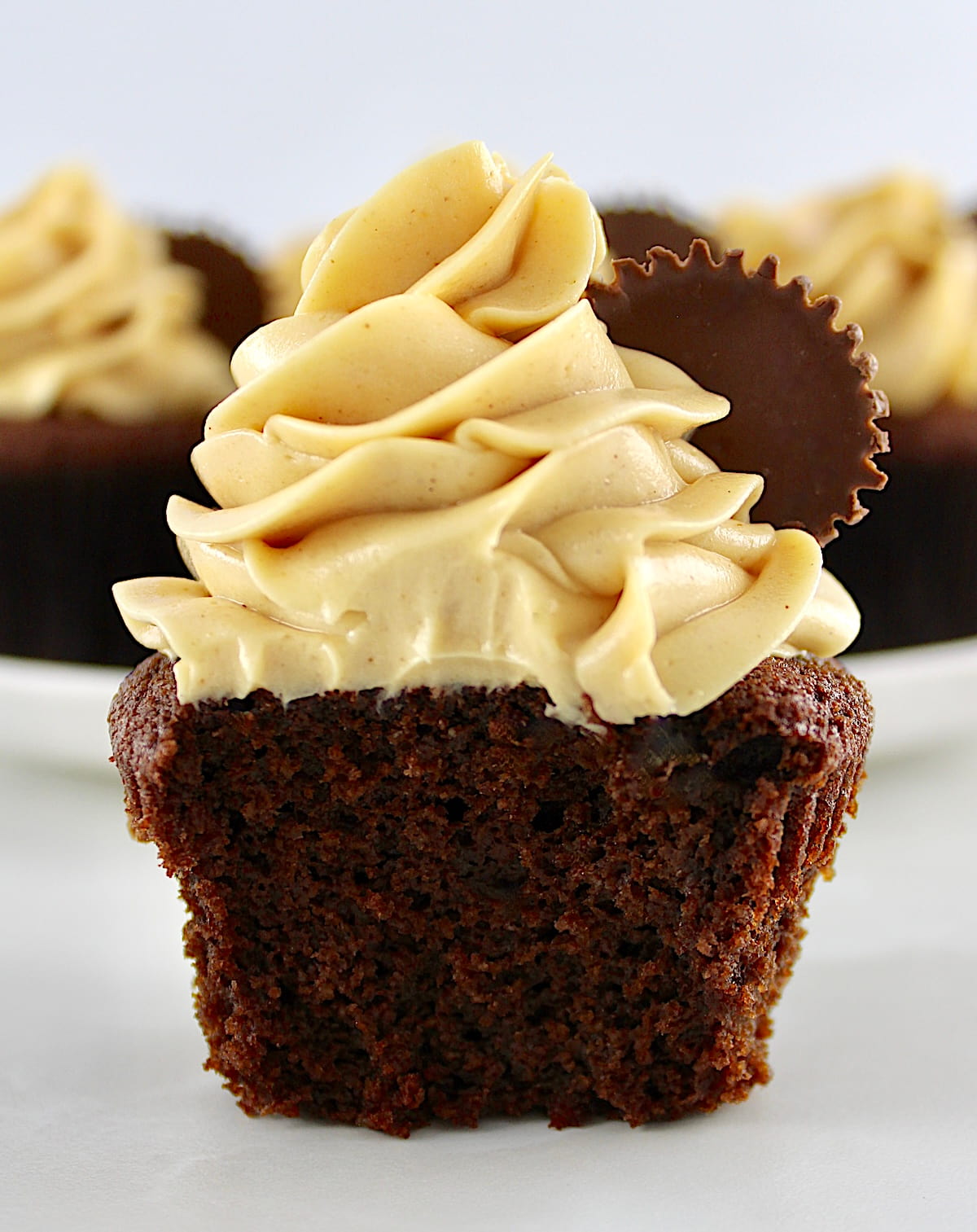 Keto Chocolate Cupcake with Peanut Butter Frosting cut in half
