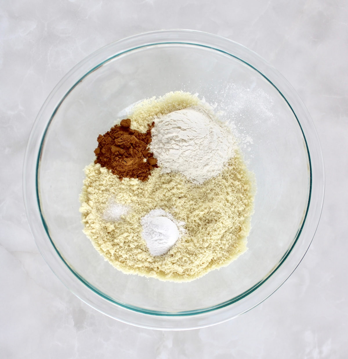 Keto Pumpkin Donuts dry ingredients in glass bowl unmixed