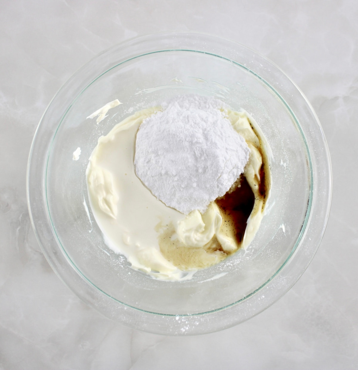Keto Pumpkin Donuts glaze ingredients in glass bowl unmixed