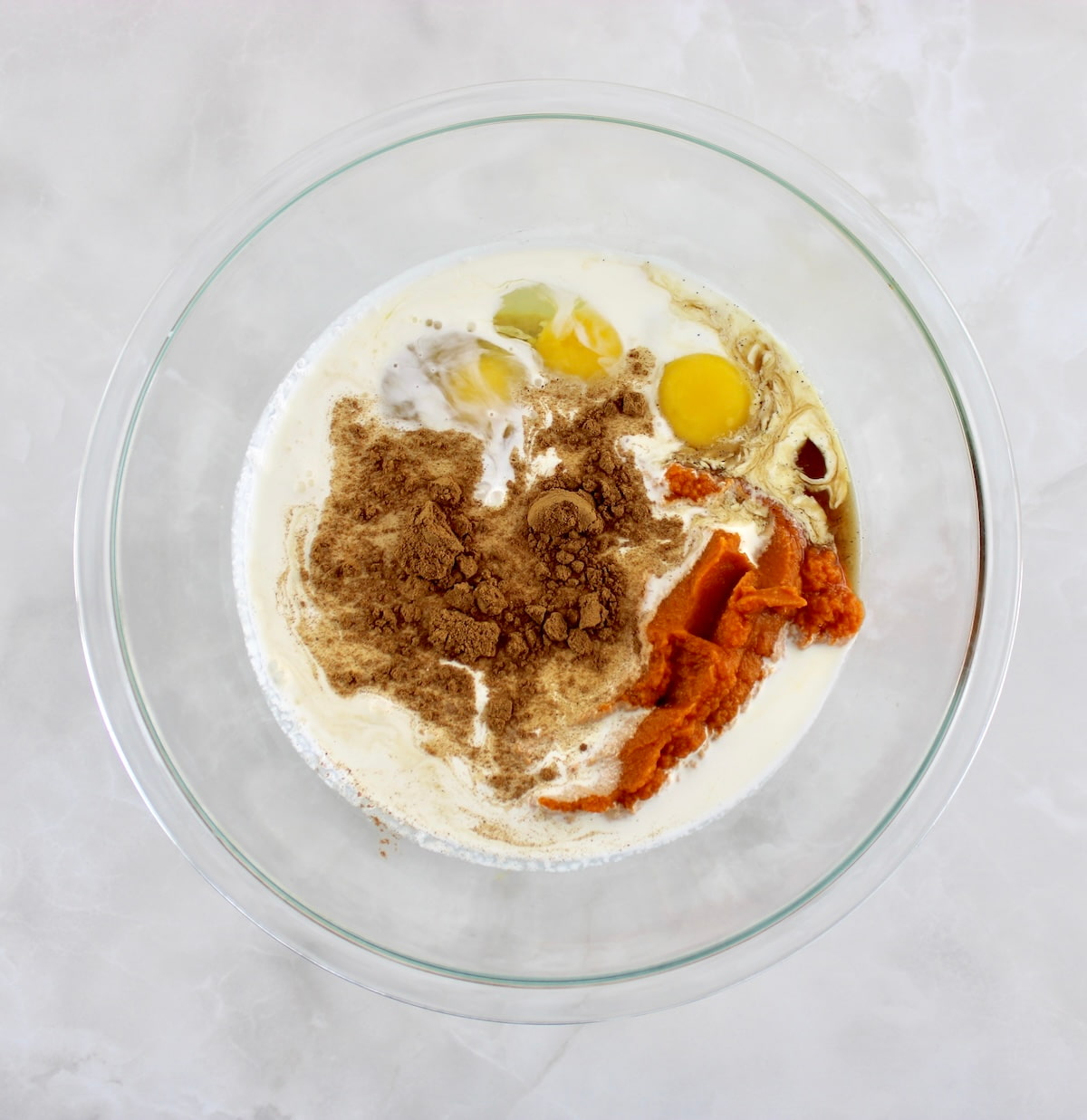 Keto Pumpkin Pie filling ingredients in mixing bowl unmixed