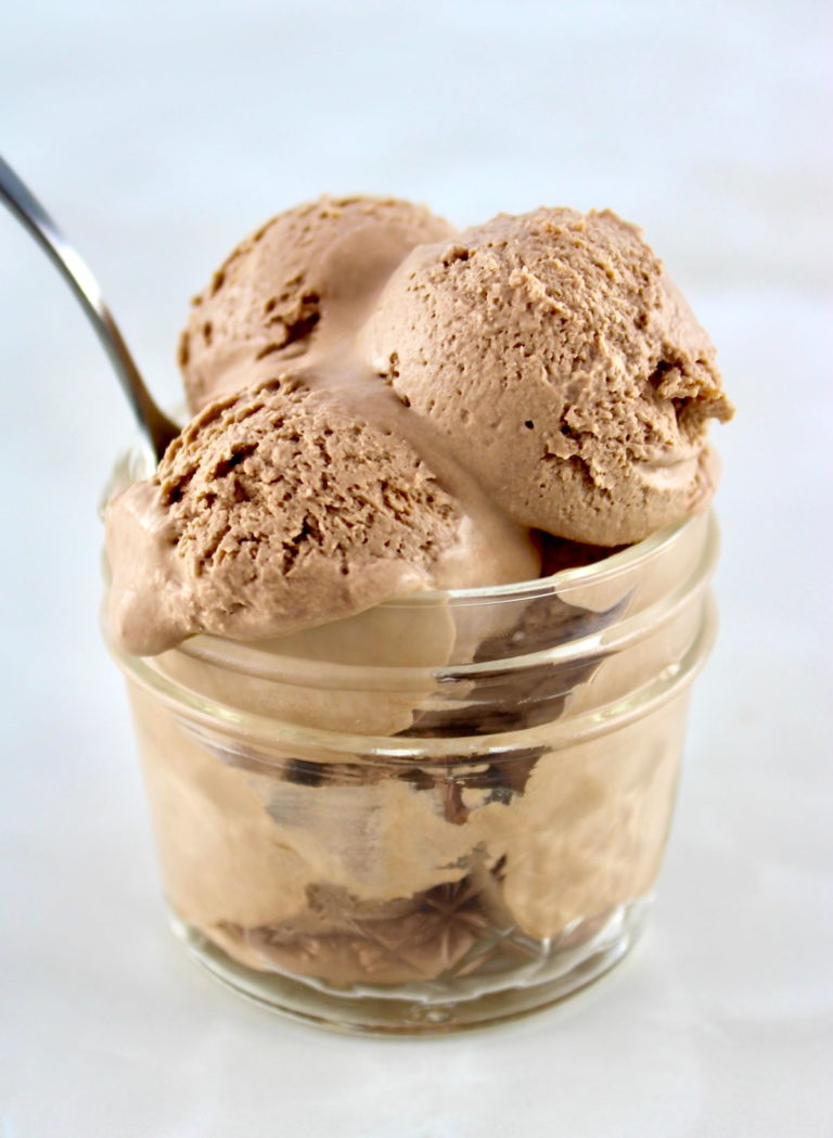 3 scoops of Mason Jar Chocolate Ice Cream in open jar with spoon