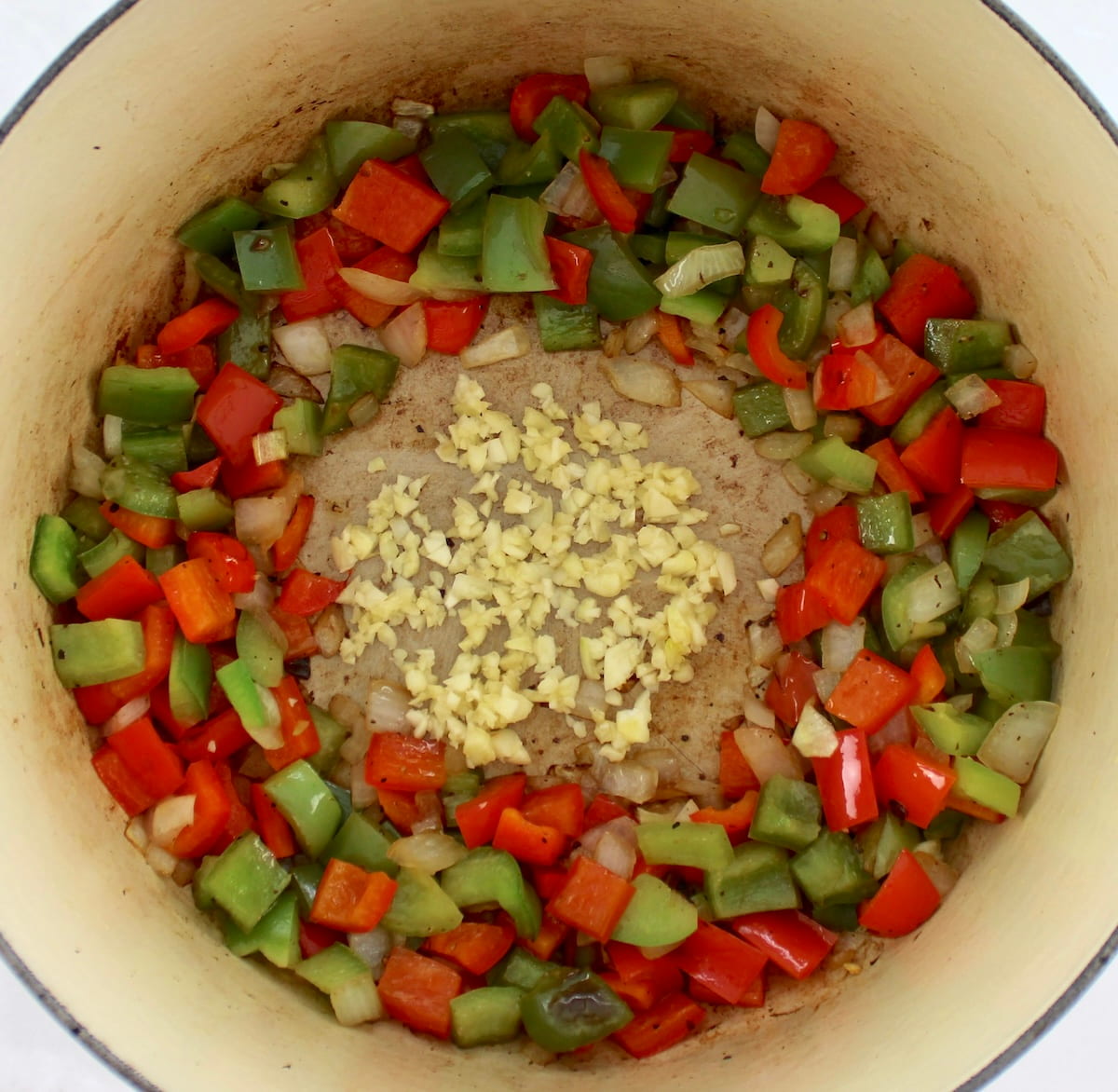 sauteed chopped bell peppers, onions and garlic in dutch oven
