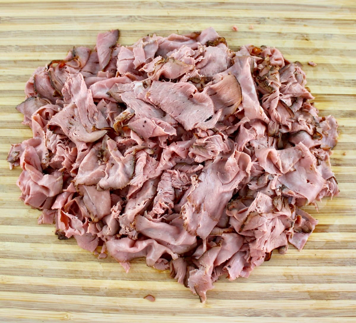 shredded roast beef on cutting board